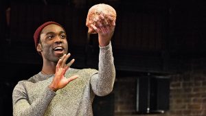 Paapa Essiedu (Hamlet) with Yorick's skull in HAMLET by Shakespeare opening at the Royal Shakespeare Theatre (RSC), Stratford-upon-Avon, England on 22/03/2016 design: Paul Wills lighting: Paul Anderson director: Simon Godwin ÂÂ©Donald Cooper/Photostage donald@photostage.co.uk ref/0152